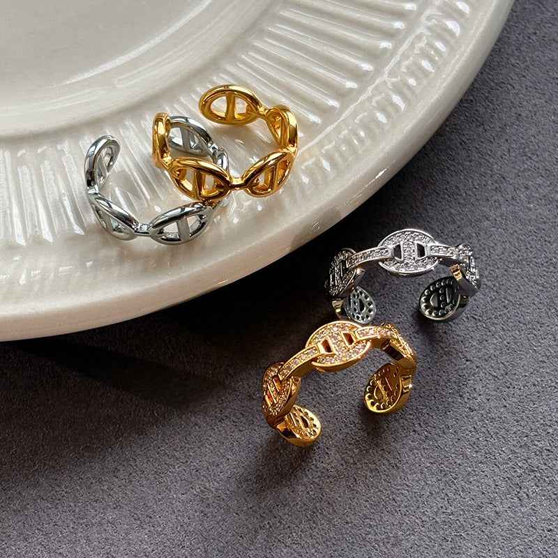 Gold and silver colored pig nose design open ring with full rhinestones for the index finger.