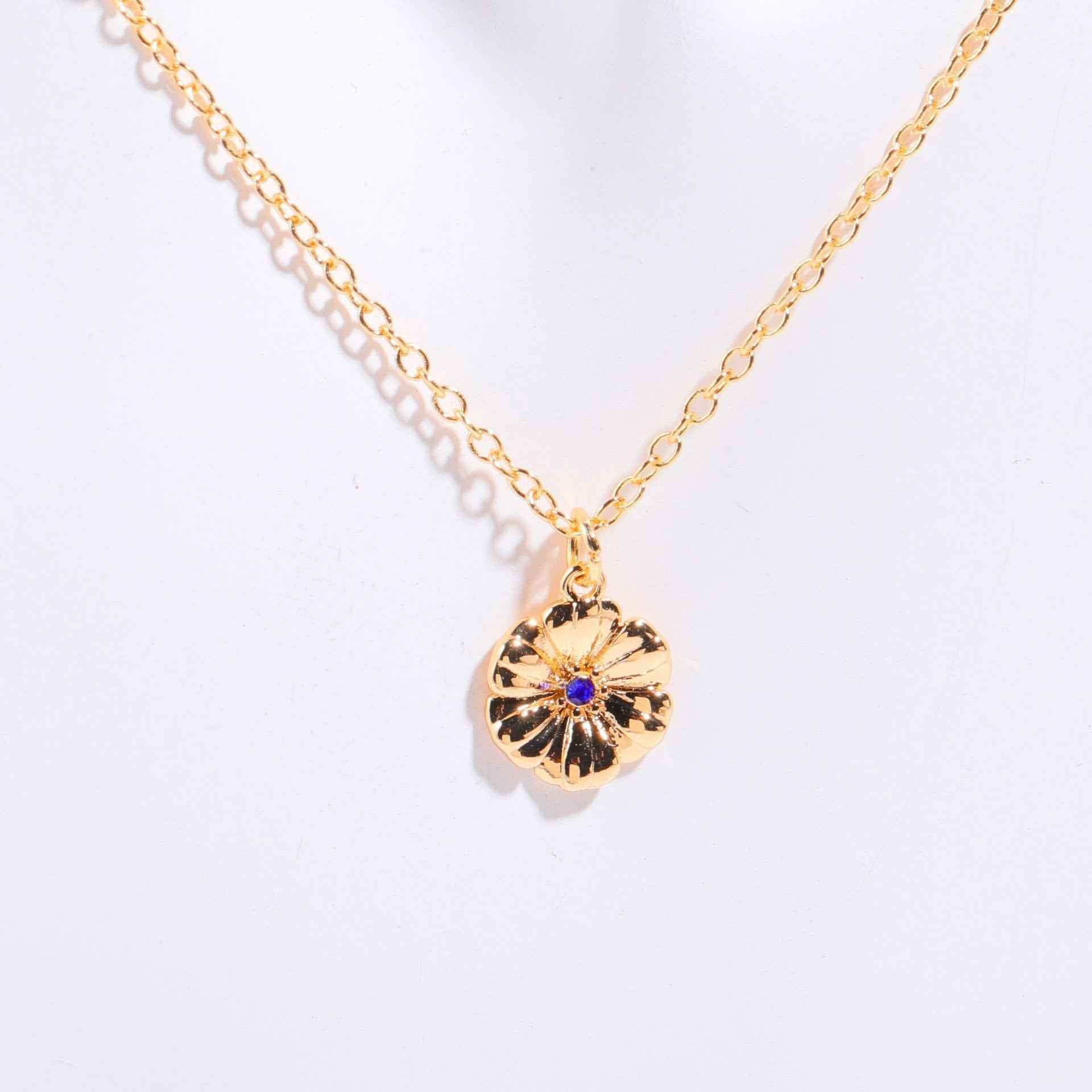 Birthstone bracelet with flower charm and cubic zirconia pendant
