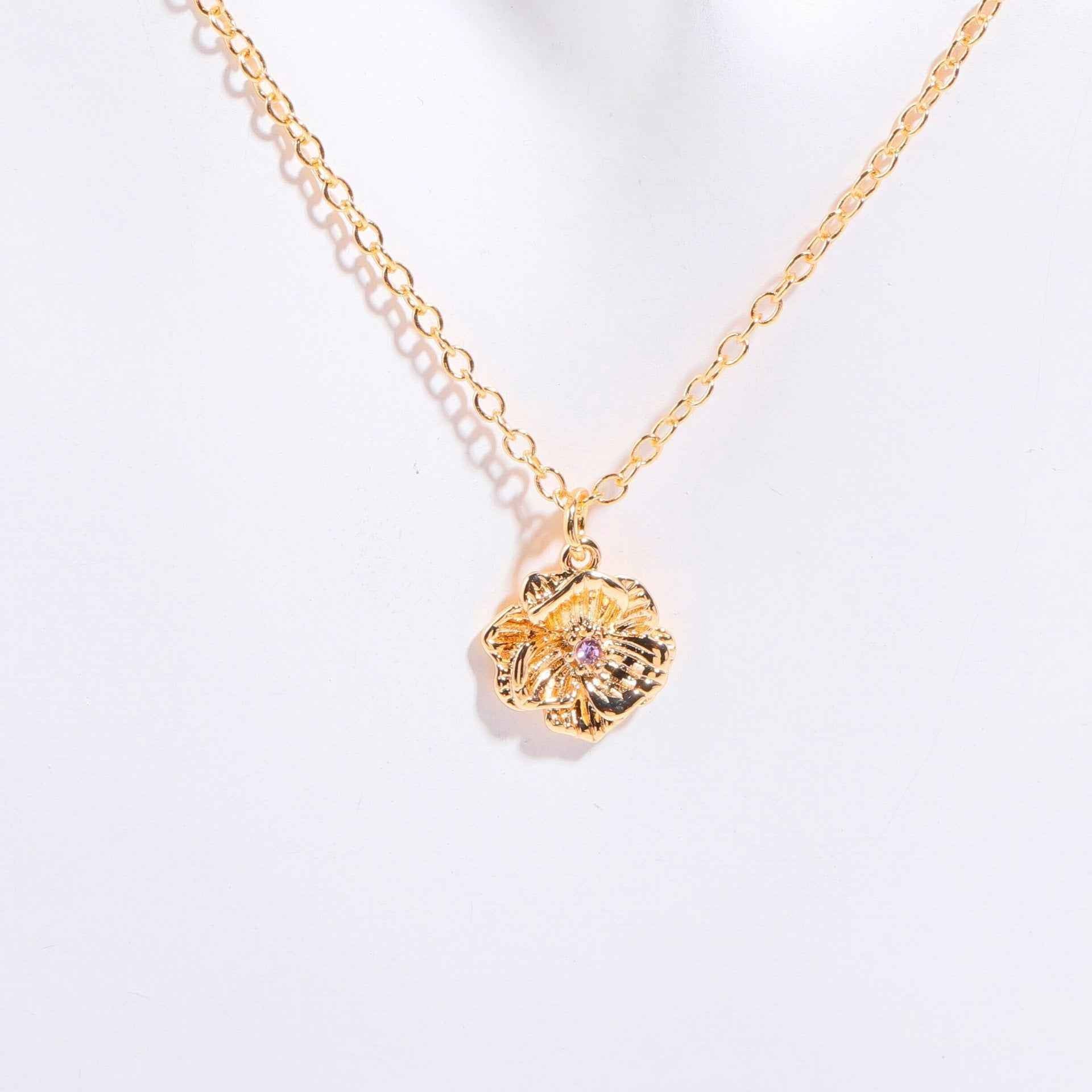 Birthstone bracelet with flower charm and cubic zirconia pendant