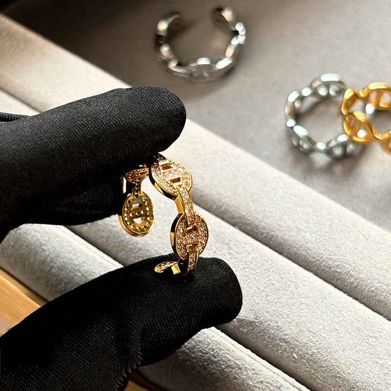 Gold and silver colored pig nose design open ring with full rhinestones for the index finger.
