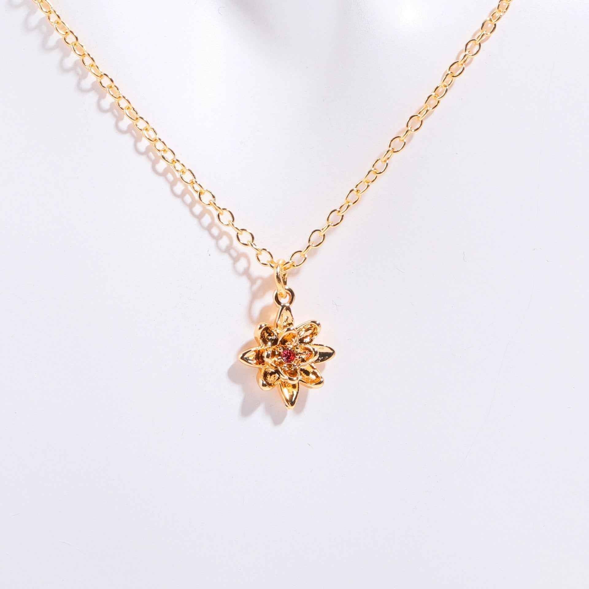 Birthstone bracelet with flower charm and cubic zirconia pendant