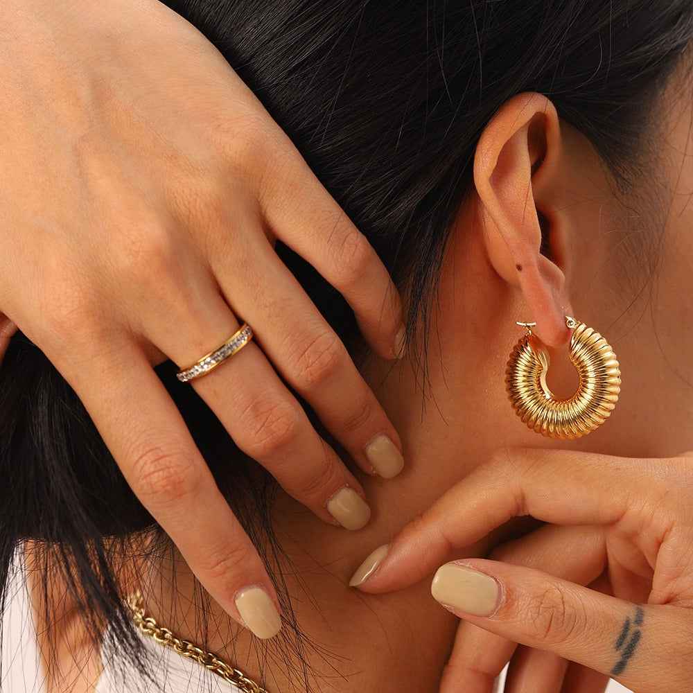 18K gold-plated, lightweight, and luxurious titanium steel stud earrings.